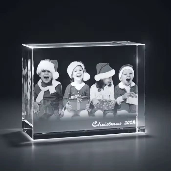 Custom glass photo block with kids in Christmas hats, perfect holiday keepsake.